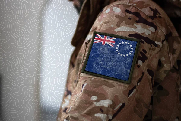 Cook Islands Soldier. Soldier with flag Cook Islands, Cook Islands flag on a military uniform. Camouflage clothing