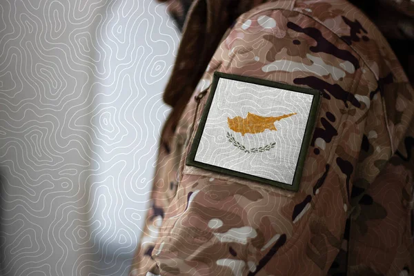Cyprus Soldier. Soldier with flag Cyprus, Cyprus flag on a military uniform. Camouflage clothing