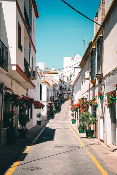 Ronda, Spain - May 23 2019: Typical street in an old town in Spain