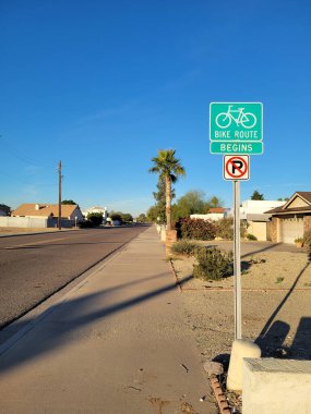 Bright lit by early morning sun road sign for bicyclist to begin their safe ride in a dedicated lane