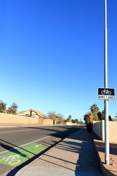 Road sign and lane marker showing a designated bike lane