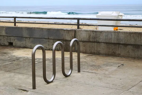 stock image Public stainless steel wave shaped bike racks waiting for visitors near Pacific beach in early morning hours, San Diego, California