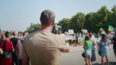 Ukrainian women and men gathered for a peaceful rally in support of the Azov prisoners of war, and the victims in Olenevka and Mariupol, demand the release of prisoners. Rally for freedom. No war in