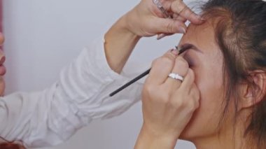 cosmetics and work as a stylist and makeup artist, women paint lips, eyes, face,