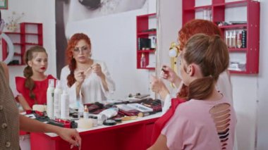 cosmetics and work as a stylist and makeup artist, women paint lips, eyes, face,