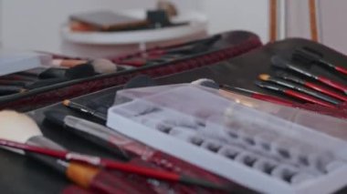 cosmetics and work as a stylist and makeup artist, women paint lips, eyes, face,