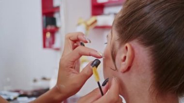 cosmetics and work as a stylist and makeup artist, women paint lips, eyes, face,