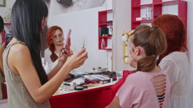 cosmetics and work as a stylist and makeup artist, women paint lips, eyes, face,