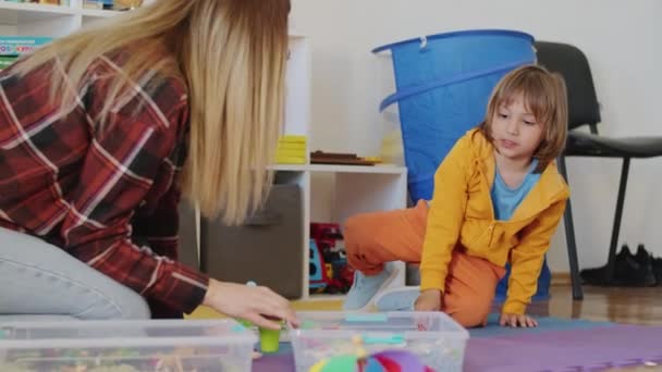 Little Boy His Babysitter Bond While Playing Creative Game Together — Stock Video