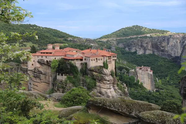 stock image Monastery on the Cliffs of Meteora, Greece, Surrounded by Greenery