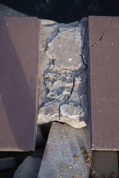 stock image Poorly Installed Pavement Tiles by the Waterside, Low-Quality Street Work Near a Waterbody