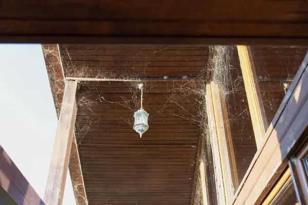 Stock image Dirty Windows Covered in Cobwebs and Dust Needing Cleaning  Neglected Glass with Spiderwebs