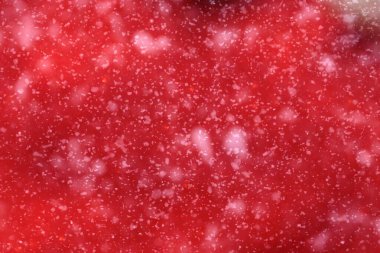 Close-up of Bright Red Textured Background with Soft Sparkle Effect clipart