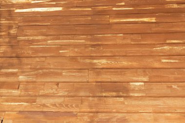 Tahta ahşap ahşap dokular ve güneş ışığı altında altın renkler.