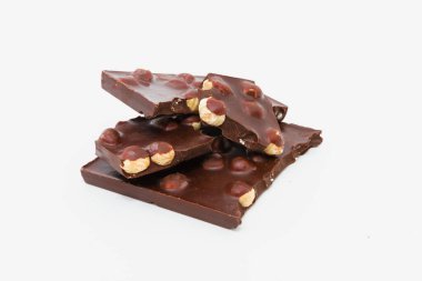 Chocolate bar with hazelnuts on a white background clipart