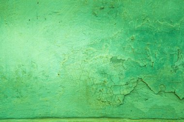 Çatlakları ve çizikleri olan beton bir duvarın dokusu arka plan olarak kullanılabilir.