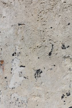 Beton duvar arka planı. Pis Grunge dokusunu kapat. Taş yüzey, eski bir duvarın parçası. Durgun bej renklerinde ayrıntılı arkaplan.