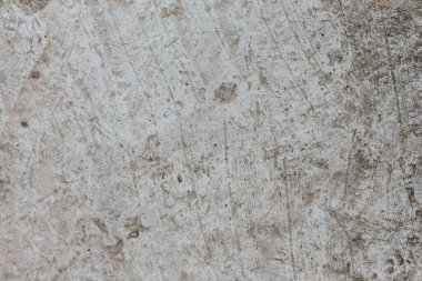 Soyut arkaplan, eski beton duvar. Detaylı desenli yakın plan. Çatlaklı ve çizikli beton duvar. Tasarımlarınıza kolayca derinlik ve organik doku ekleyin. Gri palette en az kentsel resim.