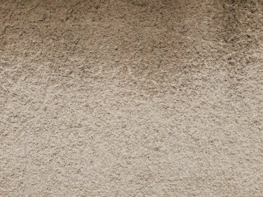 Çatlaklar ve çiziklerle dolu alçı bir duvar. Ayrıntılı grunge dokusu. Beton yüzey arka planı. Kısa bir fotoğraf ve mesaj için yer var. Tasarımlarınıza kolayca derinlik ve organik doku ekleyin.