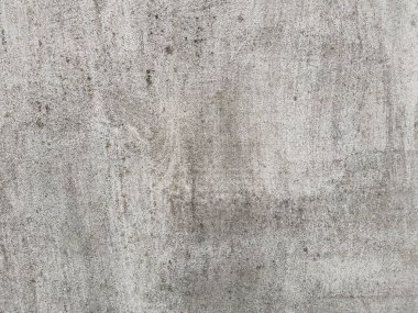 Gri yıpranmış beton duvar arka planı. Grunge desenli eski bir beton duvar. Tasarımlarınıza kolayca derinlik ve organik doku ekleyin. Asgari şehir fotoğrafı.