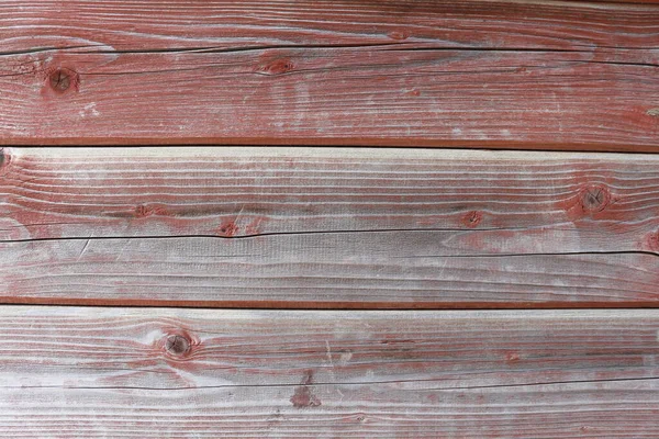 A hardwood aged wall background. Wooden red texture of a natural tree. The wood panel has a beautiful organic pattern.