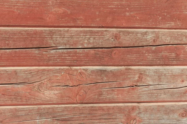 A hardwood aged wall background. Wooden red planks, a texture of a natural tree. The wood panel has a beautiful organic pattern. Easily add depth and organic texture to your designs.