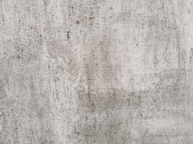 Yıpranmış beton duvar arka planı. Grunge desenli eski gri beton bir duvar. Tasarımlarınıza kolayca derinlik ve organik doku ekleyin. Asgari şehir fotoğrafı.