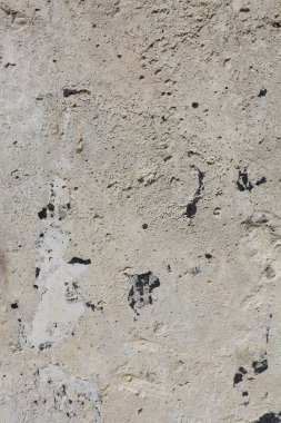 Sakin bej renklerde ayrıntılı bir arkaplan. Beton duvar arka planı. Taş yüzey, eski bir duvarın parçası. Grunge dokusu kapat..