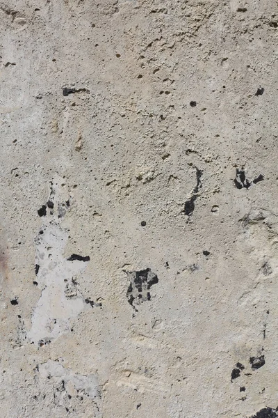 Sakin bej renklerde ayrıntılı bir arkaplan. Beton duvar arka planı. Taş yüzey, eski bir duvarın parçası. Grunge dokusu kapat..
