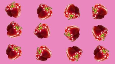 Tatlı biberler renkli bir arka planda sallanıyor. Vejetaryen teması