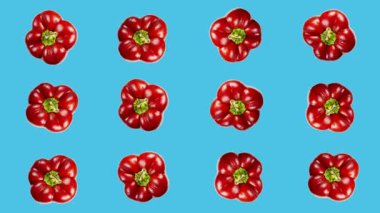 Tatlı biberler renkli bir arka planda sallanıyor. Vejetaryen teması