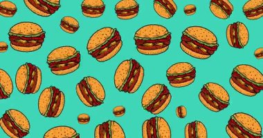 Renkli bir arka planda hamburgerler sallanıyor. 