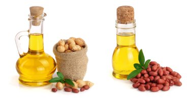 bir cam şişe içinde fıstık yağı çanta içinde fıstık ile.