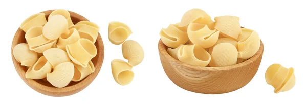 stock image lumaconi pasta in wooden bowl isolated on white background with full depth of field. Top view. Flat lay.