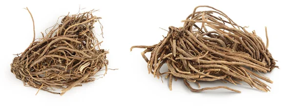 stock image Dried Valerian root isolated on white background. Valeriana officinalis with full depth of field. Top view. Flat lay.