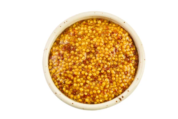 Fransız hardallı kase beyaz arka planda izole edilmiş, geniş bir alana yayılmış. Üst Manzara. Düz yatıyordu