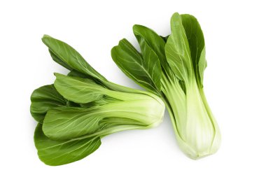 Beyaz arka planda taze pak choi lahanası var. Üst Manzara. Düz yatıyordu.