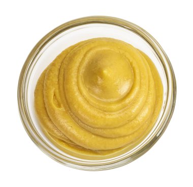 Cam kasede hardal sosu ve beyaz arka planda izole edilmiş tohum. Üst Manzara. Düz yatıyordu.