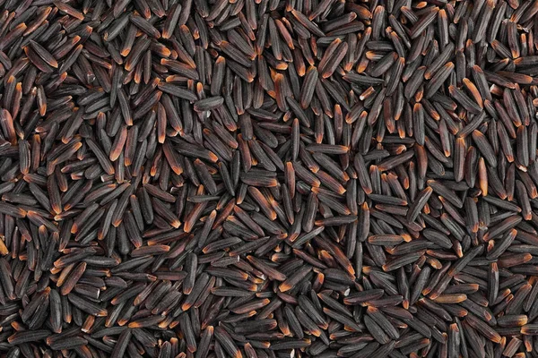 Arkaplan olarak siyah pirinç. Üst Manzara. Düz yatıyordu.