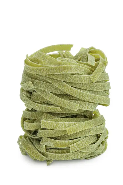 stock image Raw tagliatelle green pasta with spinach isolated on white background.