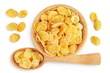 Tahta kasede mısır gevreği ve beyaz arka planda izole edilmiş kaşık. Üst Manzara. Düz yatıyordu.