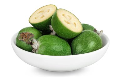 Feijoa fruit in ceramic bowl isolated on white background. clipart