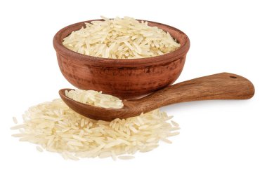 rice basmati in a ceramic bowl and wooden spoon isolated on white background.