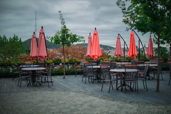 stock image empty restaurant patio furniture view point in city park land outdoor environment space of cold autumn cloudy day time