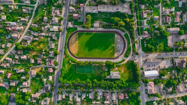 aerial city top view summer season football field stadium complex in suburban American living urban environment space