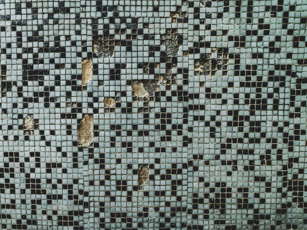 black and white mosaic on the wall