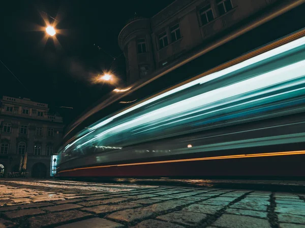 stock image tram in motion on city street at night