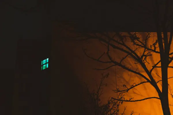 glowing window to the courtyard at night