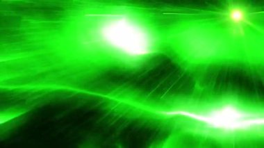 Soyut hareket arkaplanı renkli parçacıklar parlıyor. Kusursuz 4K döngü videosu.