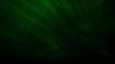 Soyut hareket arkaplanı renkli parçacıklar parlıyor. Kusursuz 4K döngü videosu.